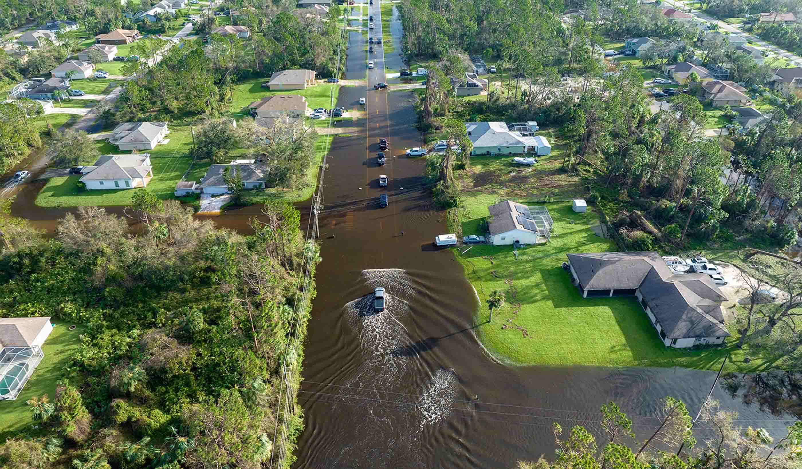 Physically based dimensionless features for pluvial flood mapping with machine learning